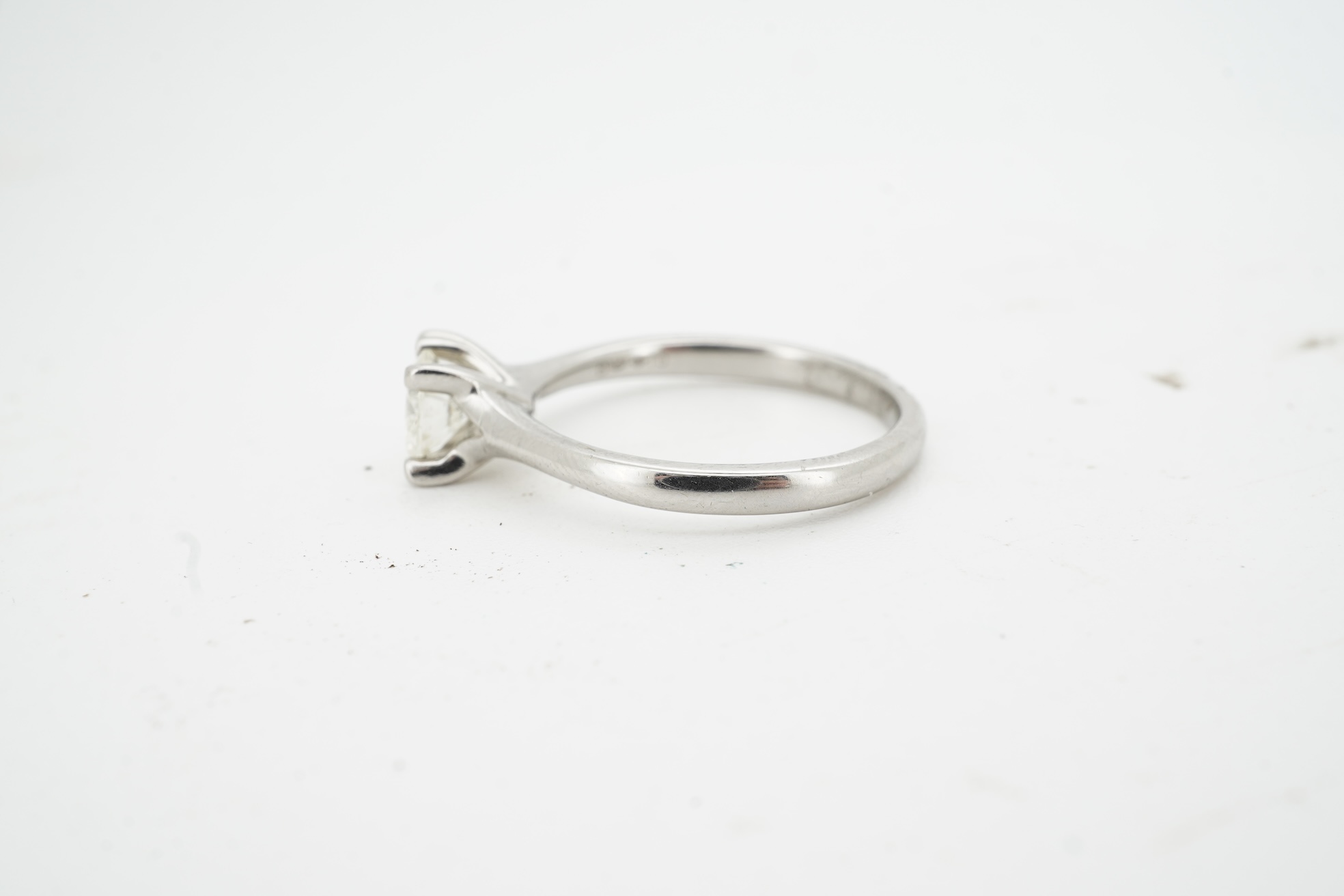 A diamond ring, claw-set with a brilliant-cut diamond weighing approximately 0.50 carats, mounted in platinum, size K, British hallmarks, gross weight approximately 4 grams